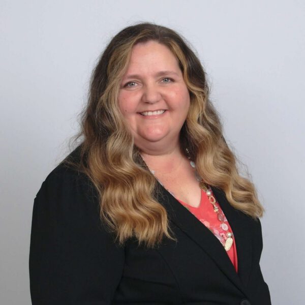 Professional headshot of Christina Paulk, part of Sevenstar Academy’s leadership team, posed against a neutral backdrop.