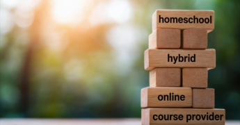 Stacked building blocks with the words homeschool, hybrid, online, and course provider written on some of them.